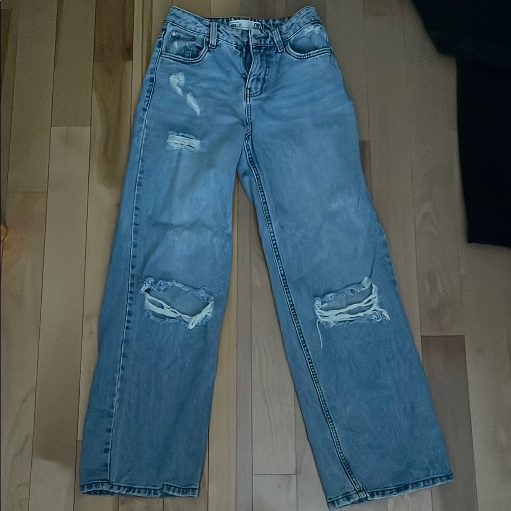 Distressed blue jeans